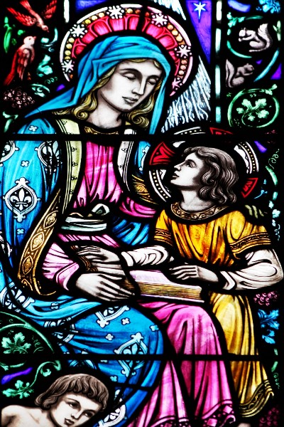 Detailed close-up of a stained glass window showing craftsmanship and paint quality